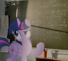 a pink pony standing in front of a chalkboard with writing on it's side