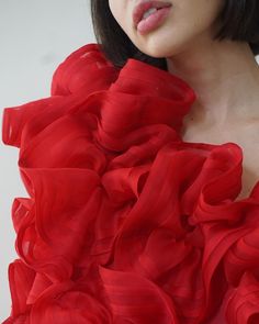 The Ellaella Pouf Dress is a stunning display of haute romance, made to order for special occasions and red-carpet affairs. This bold artful dress is entirely made by hand with couture sewing techniques, with each red silk organza hand-pleated bloom stitched, gathered, and sewn on by our skilled team in New York. 100% silk organza Upon placing your order, please e-mail us at info@jasminechong.com with order number and sizing information. Added customisation (lengthening, etc.) may incur addition Red Organza Dress For Gala, Silk Couture Evening Dress For Parties, Red Fitted Bodice Organza Dress, Red Fitted Organza Gown, Red Pre-draped Dress With Fitted Bodice, Couture Ruffled Gown For Gala, Elegant Red Organza Evening Dress, Couture Gala Gown With Ruffles, Red Organza Floor-length Dress