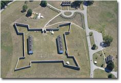 an aerial view of a fort in the middle of a field