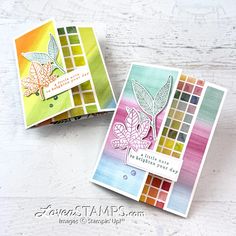 two cards with leaves on them sitting next to each other, one is made out of colored paper