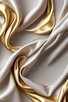 white and gold fabric with wavy folds in the center, as if it were silk