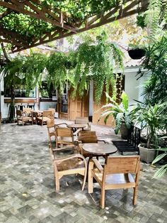 an outdoor dining area with tables and chairs