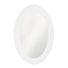 a white round mirror on a white wall