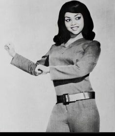 an old black and white photo of a woman dressed as star trek captain kirken