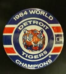 the detroit tigers logo is displayed on a wall in front of a black background with red, white and blue stripes