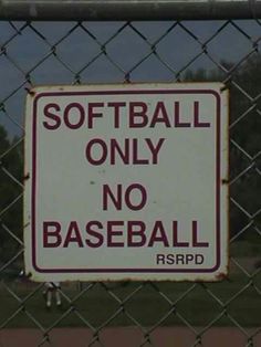 a sign on a chain link fence that says softball only no base ball rspd