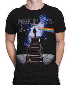 a man standing on top of a stairway next to the moon with a pink floyd t - shirt