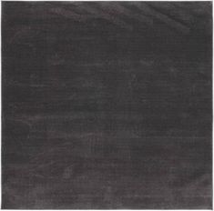 an area rug with dark grey colors