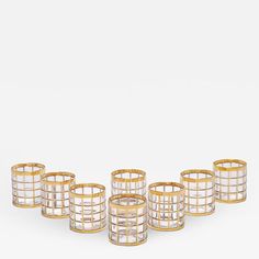 six gold and clear glass candle holders