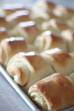 freshly baked bread rolls in a baking pan