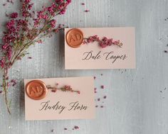 two pink cards with flowers on them sitting next to each other and the words dok together