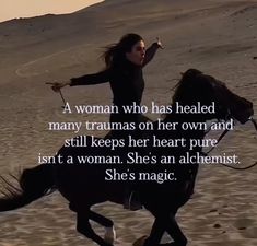 a woman riding on the back of a black horse next to a sandy beach with a quote from she's magic