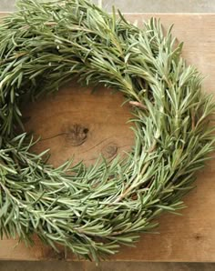 a close up of a wreath on a wooden board