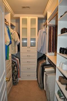 a walk in closet filled with lots of clothes