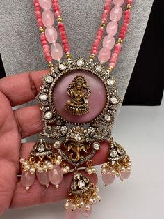 Moissanite Victoraian Ganesha Lakshmi Devi Monalisa Beads Necklace with matching earringsColor : VictorianSize : Necklace Length : 22 Inches; Pendent : 3.75 Inches; Earring Length : 2.25 Inches ApproxStones : CZ --Color-- Stone Beads Pearls