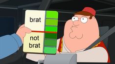 a man holding up a box with the words brat not bratt on it