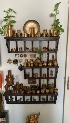 there are many brass items on the shelves