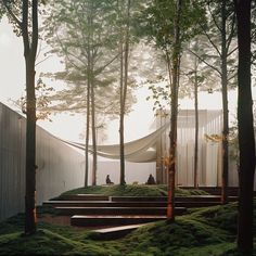 an outdoor area with steps, trees and grass