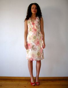 "Vintage Floral summer dress, Peach pink cosmos flower print gown, creppe ruffle dress, women lined sundress, gift for her, size medium Fit/Size:  Medium (EUR 38) Measurements: Length: 42\" Bust: 33\" Hips: 38 Please check measurements to insure a proper fit. Remember to allow yourself some extra room for movement. You can compare these with something from your closet that fits you well. Please convo me if you need additional measurements. This dress will come to you freshly laundered and ready to wear. Condition: great Vintage Condition SHIPPING * I ship worldwide via Priority mail (Latvijas Pasts) from Latvia (EU). * I ship from Europe, so please allow 2 to 4 weeks for the package to arrive if you live overseas. * Europe 5 - 10 business days. Go back to my shop: VintageDreamBox.etsy.com Fitted Floral Maxi Dress With Ruffle Hem, Elegant Pink Knee-length Sundress, Feminine Silk Floral Dress For Spring, Fitted Summer Maxi Dress With Ruffle Hem, Elegant Chiffon Sundress With Ruffles, Pink Ruffle Hem Maxi Sundress, Pink Ruffle Hem Sundress Maxi Dress, Pink Fitted Knee-length Sundress, Fitted Chiffon Sundress