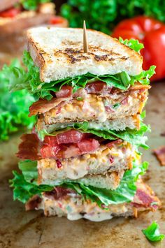 a cut in half sandwich sitting on top of a cutting board