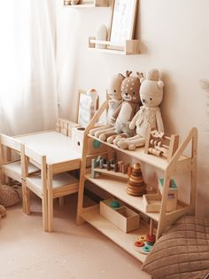 there are many stuffed animals on the shelves in this child's playroom with toys