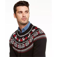 a man wearing an ugly sweater looks at the camera