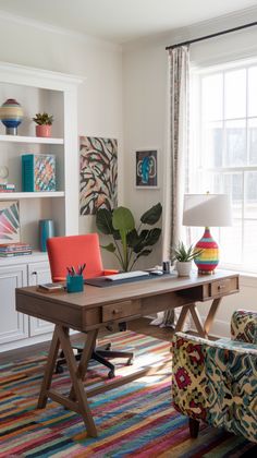 a room with a desk, chair and bookshelf filled with colorful art on the walls