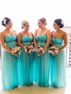 the bridesmaids are all wearing blue dresses