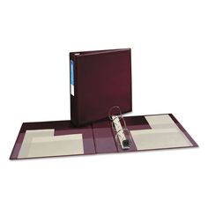 a binder with two binders attached to it and a clipboard on top