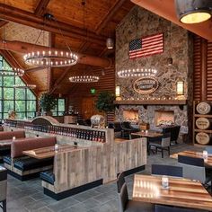 the inside of a restaurant with tables and chairs