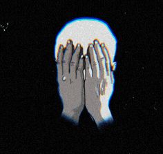 two hands covering their faces in the dark