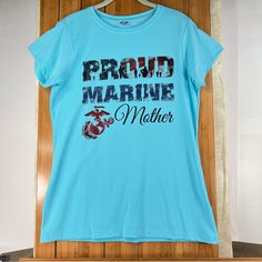 a blue shirt that says proud marine mother