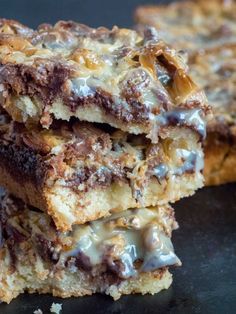 three pieces of chocolate chip cookie bars stacked on top of each other