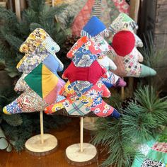 three small christmas trees made out of fabric