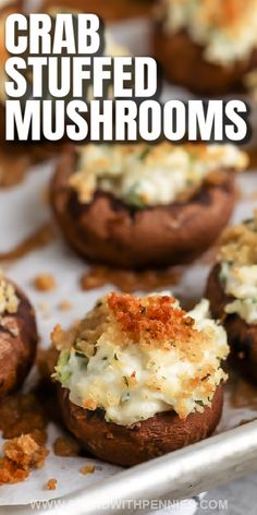 crab stuffed mushrooms on a baking sheet with text overlay