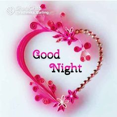 the words good night written in a heart shape with pink flowers and leaves on it