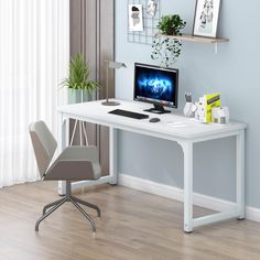 a white desk with a computer on it