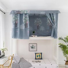 a bedroom with blue curtains and white walls