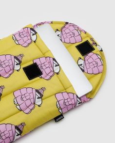 a yellow and pink bag with cartoon characters on it