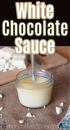 white chocolate sauce in a glass jar with spoon