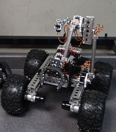 a robot car with four wheels on the floor