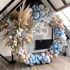 a baby shower decoration made out of balloons