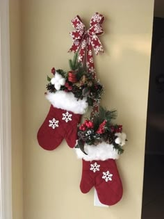 two christmas stockings hanging on the wall