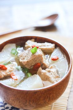 there are many different pictures of food in the bowl and on the table, including tofu