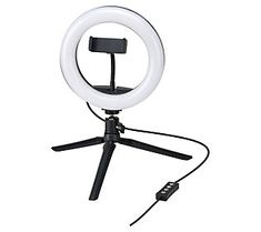 a white ring light on top of a tripod