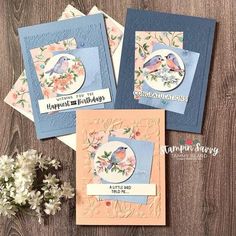 three cards with flowers and birds on them