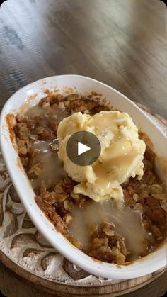 a bowl filled with food on top of a wooden table