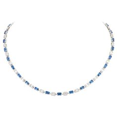 The Following Item we are offering is this Rare Important Radiant 18KT Gold Gorgeous Glittering and Sparkling Magnificent Fancy Cut Blue Sapphire and Diamond Necklace. Necklace contains approx 10CTS of Beautiful Fancy Cut Blue Sapphires and Diamonds!!! Stones are Very Clean and Extremely Fine!!! This Gorgeous Necklace is a Rare Sample Piece and Comes New with Tags $22,500.00 from a Top Private Manufacturer that sold to Important Five Star Hotel and Fine Jewelry Stores. A Rare Breathtaking Master Luxury Blue Jeweled Necklaces, Luxury Blue Diamond Cut Necklace, Luxury Blue Sapphire Necklace, Exquisite Luxury Sapphire Necklace, Luxury Blue Diamond-cut Necklace, Sapphire Diamond Necklace, Star Hotel, Luxury Necklace, Blue Sapphire Diamond