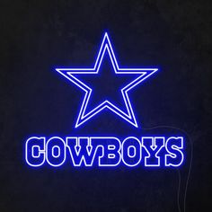 a neon sign that says cowboys with a star on it