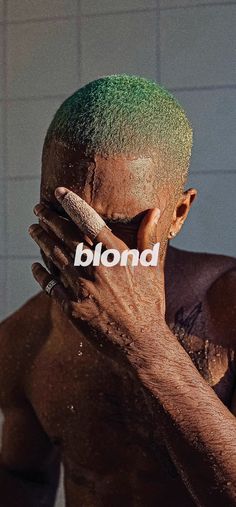 a man with green hair covering his face and the word blond written in front of him